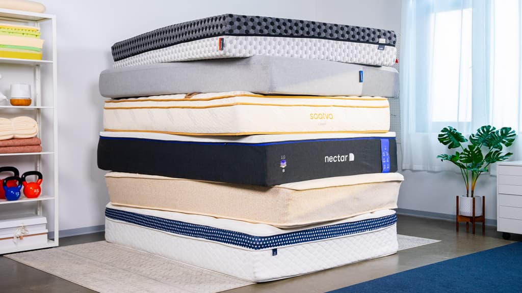 Image of a stack of hybrid mattresses, shot in our Seattle sleep test lab.