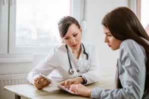 doctor and patient looking at a document