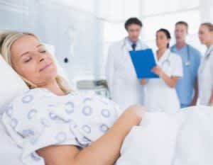 Stock image of a woman participating in a sleep study