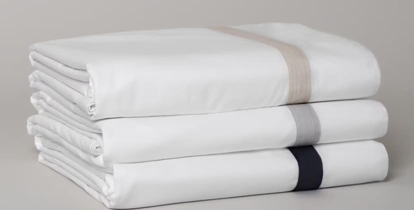 Product page photo of the Saatva Banded Percale Sheet Set