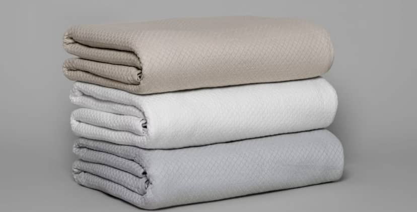 Product page photo of the Saatva Diamond Knit Blanket